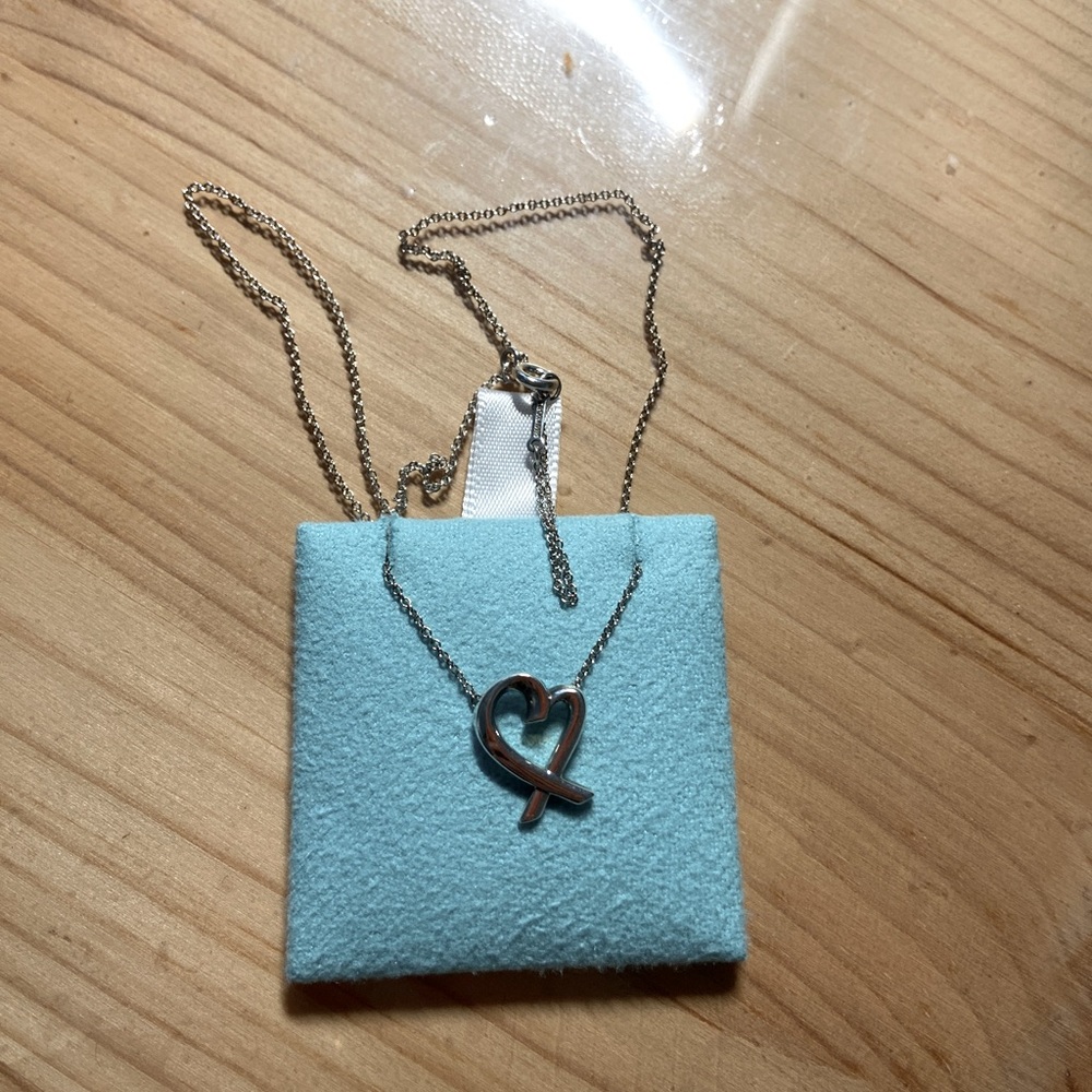 Tiffany and Co loving heart pendant necklace.